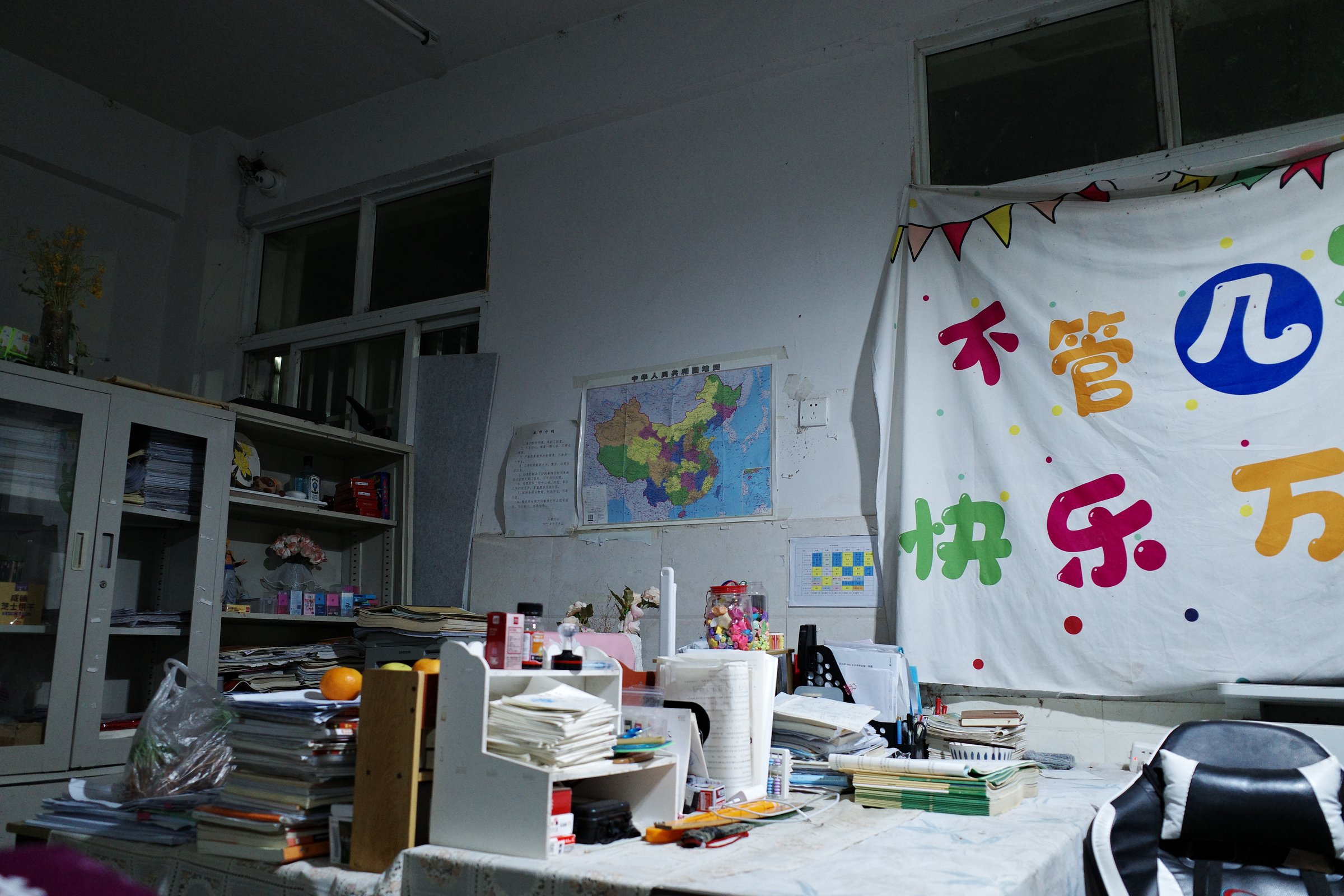 A classroom dressed up, banners and a map on the wall